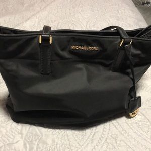 This is a Vinyl black bag